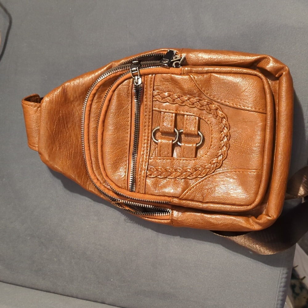 Faux leather left shoulder backpack